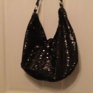 Black sequin slouch bag from Candies